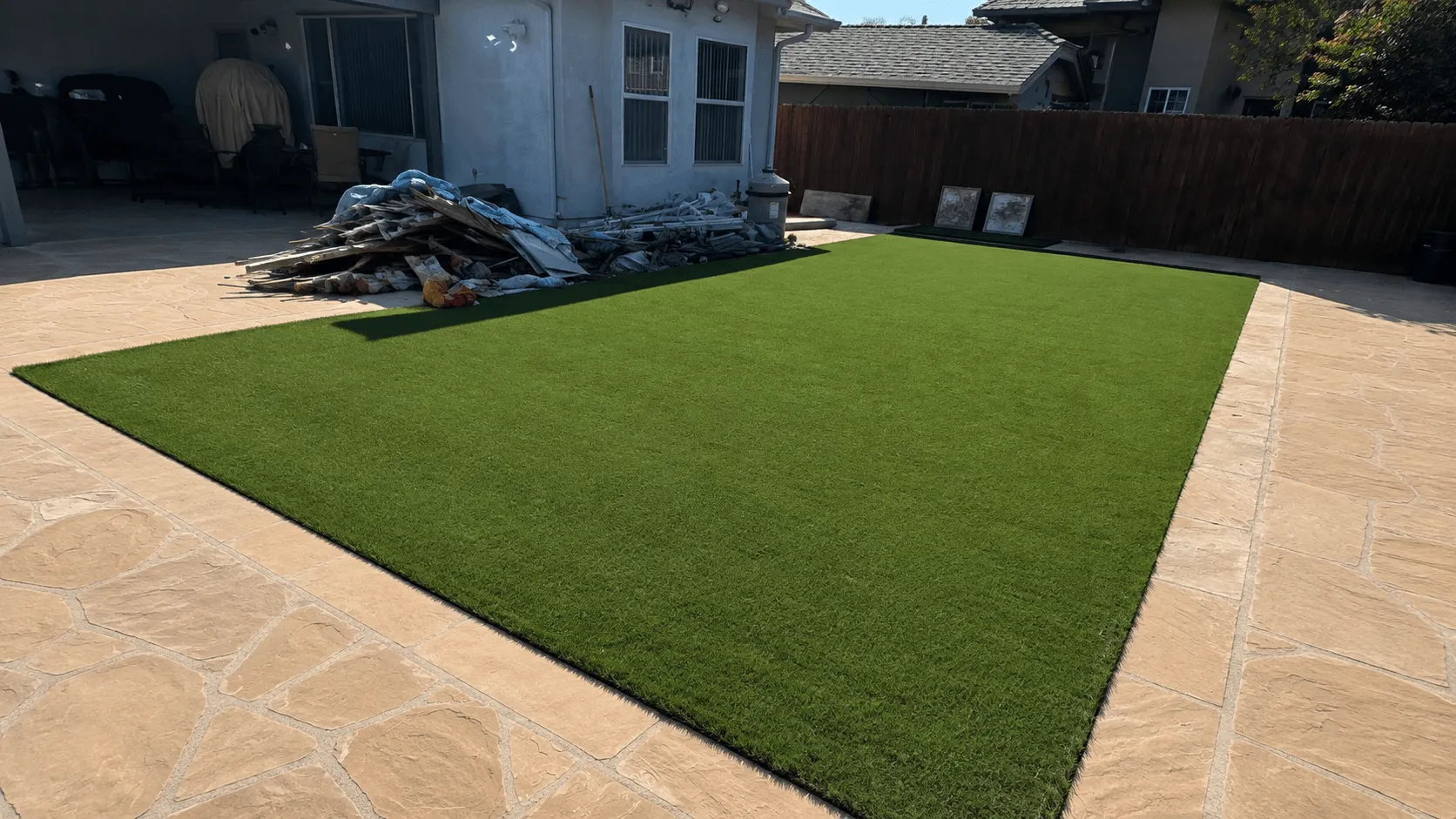Artificial turf installed after swimming pool removal in San Diego backyard