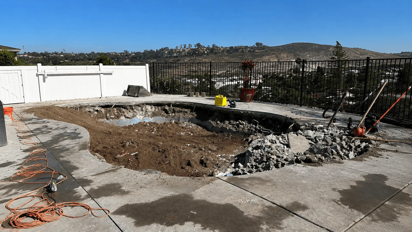 Swimming pool before demolition and backyard transformation in San Diego